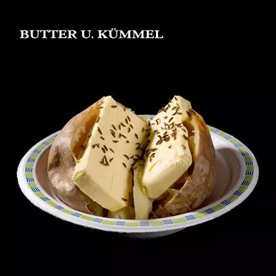 gebackene Kartoffel mit Butter u. Kümmel gebackene Kartoffel mit Butter u. Kümmel